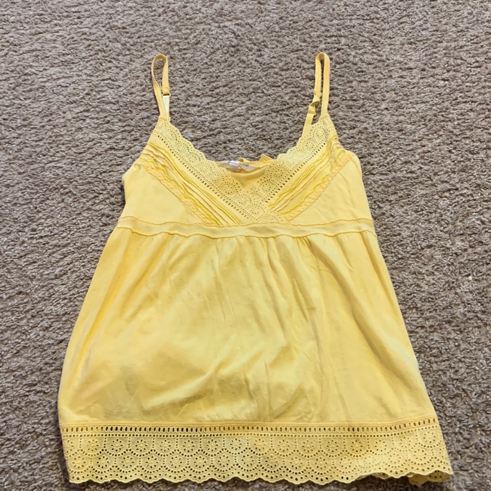 Cute yellow top with bow in the back